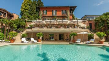 Seasonal outdoor pool, pool umbrellas, pool loungers
