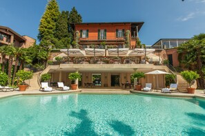 Seasonal outdoor pool, pool umbrellas, pool loungers