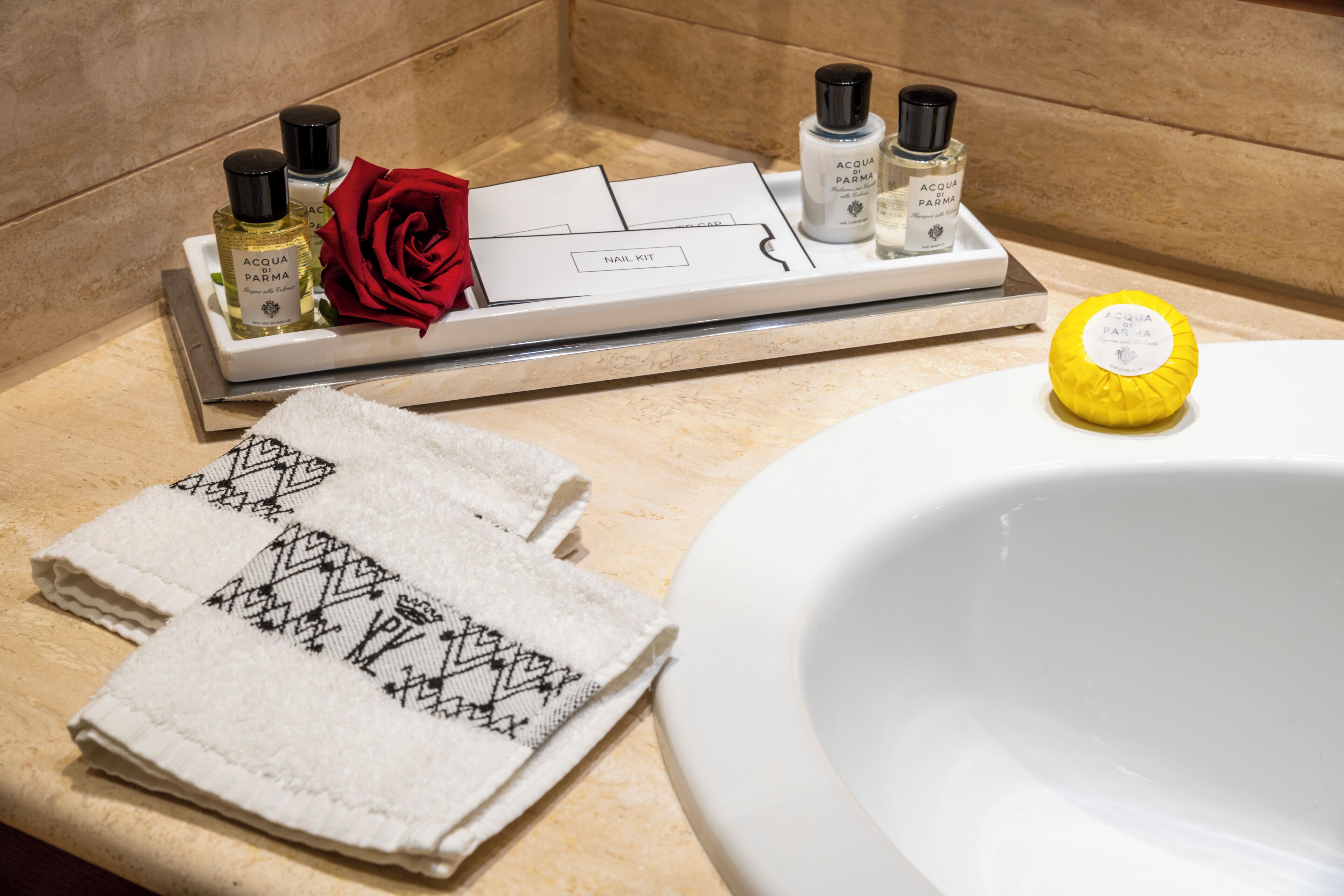 designer toiletries, hair dryer, bathrobes, slippers