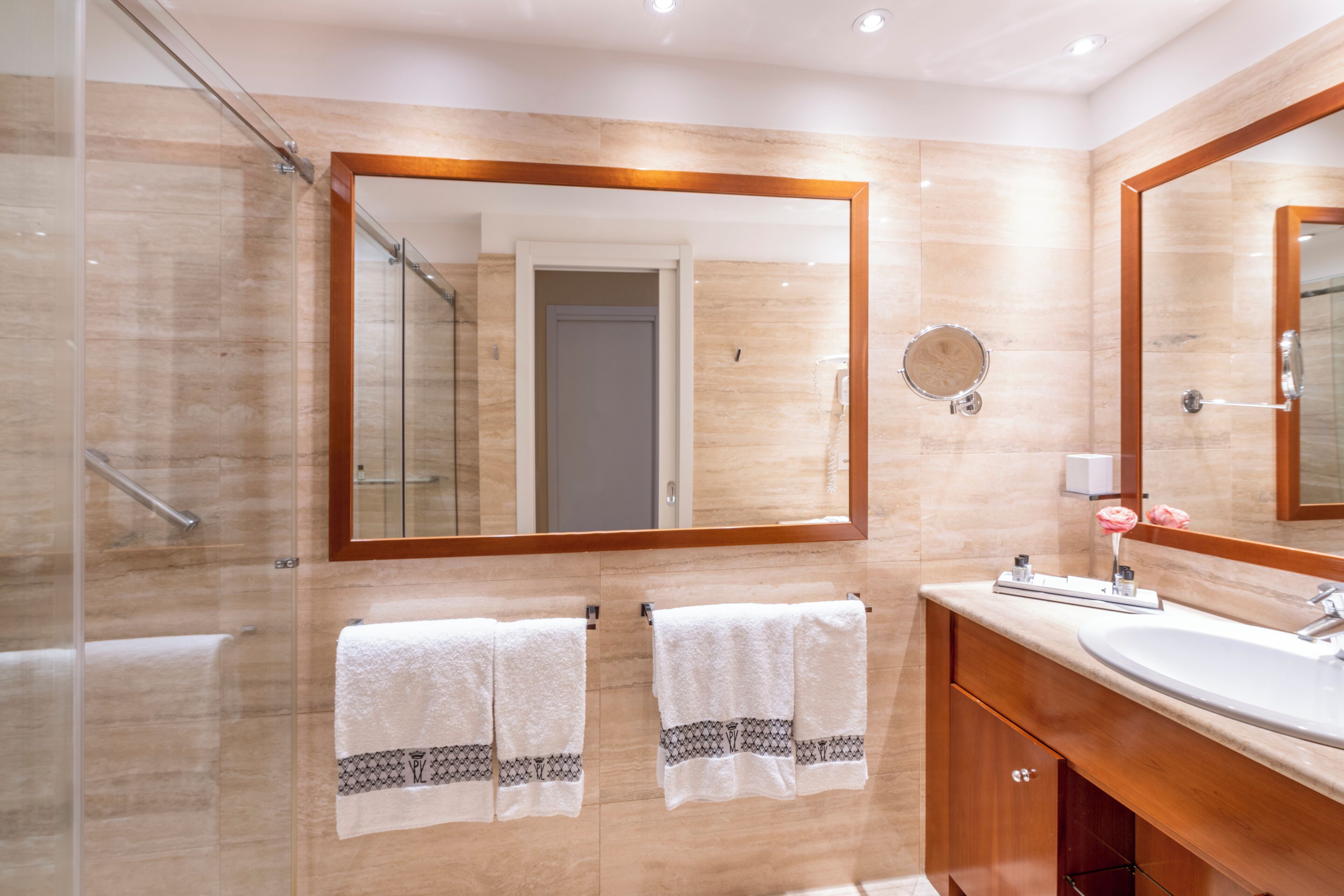 designer toiletries, hair dryer, bathrobes, slippers