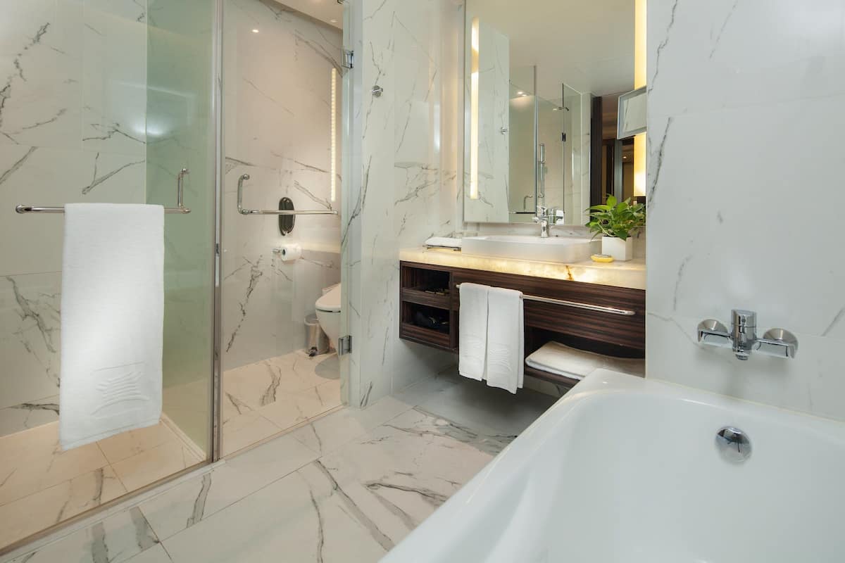 Separate tub and shower, rainfall showerhead, hair dryer, towels