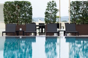 Outdoor pool, open 6:30 AM to 8:00 PM, pool umbrellas, pool loungers