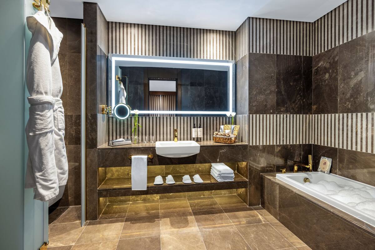 Separate tub and shower, hair dryer, bathrobes, slippers