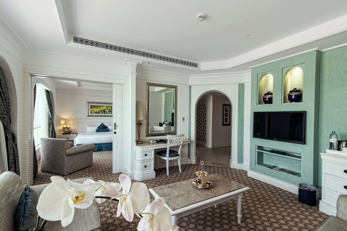 Family Suite, 1 King Bed, Smoking, Partial Sea View | Living area | LCD TV