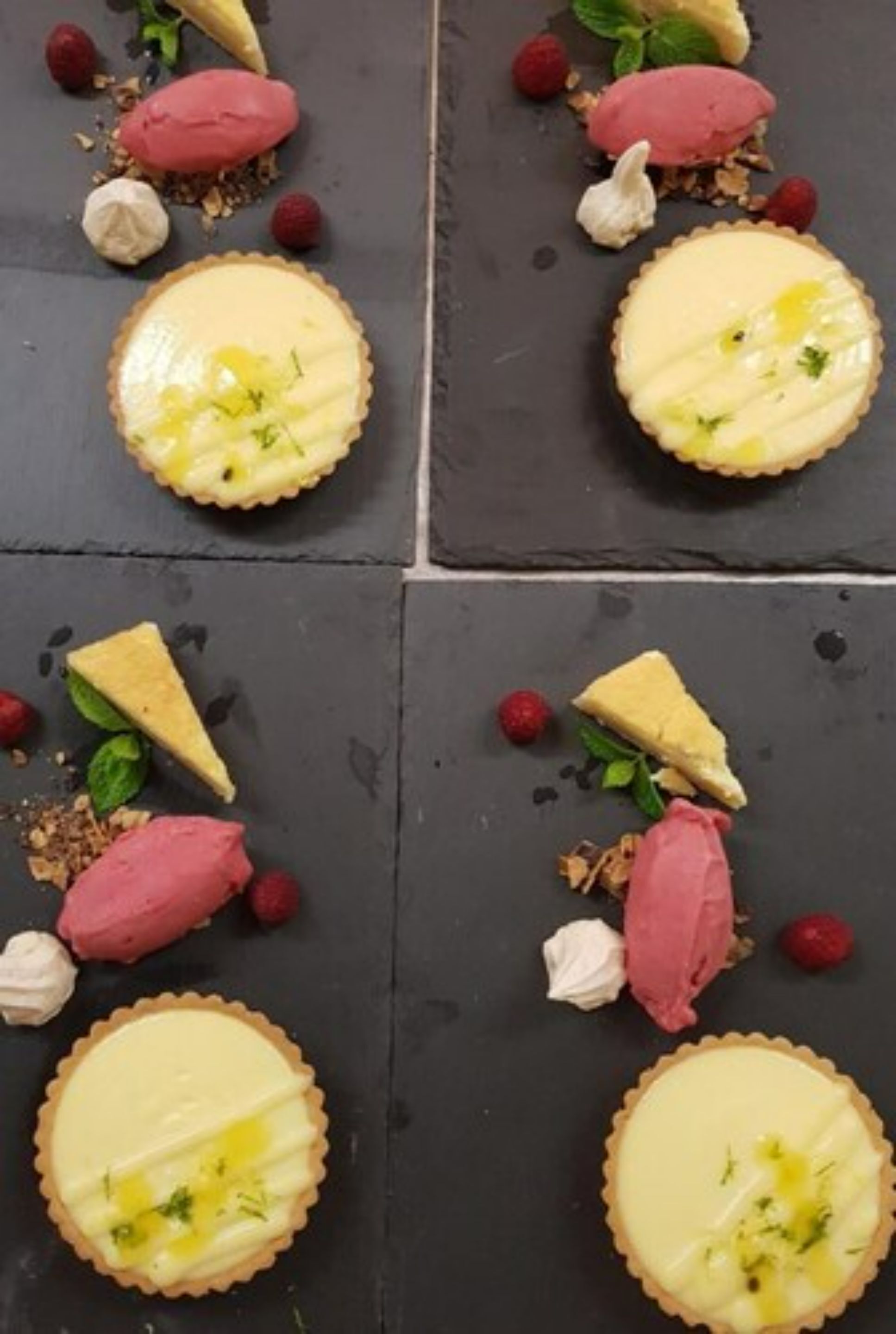 A dessert presentation with various components including a tart, ice cream, and berries.