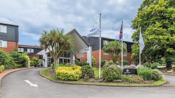 Welcome to Meon Valley, where a clear pathway leads to the main building, surrounded by beautifully landscaped gardens.