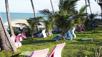 On the beach, white sand, beach towels, beach volleyball