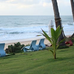 On the beach, white sand, beach towels, beach volleyball