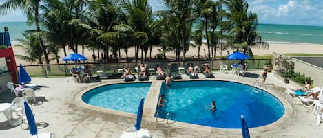 Outdoor pool, pool umbrellas, sun loungers