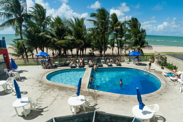 Outdoor pool, pool umbrellas, sun loungers