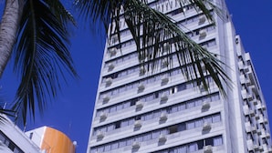 A hotel building with a sign reading "HOTEL DAN INN."