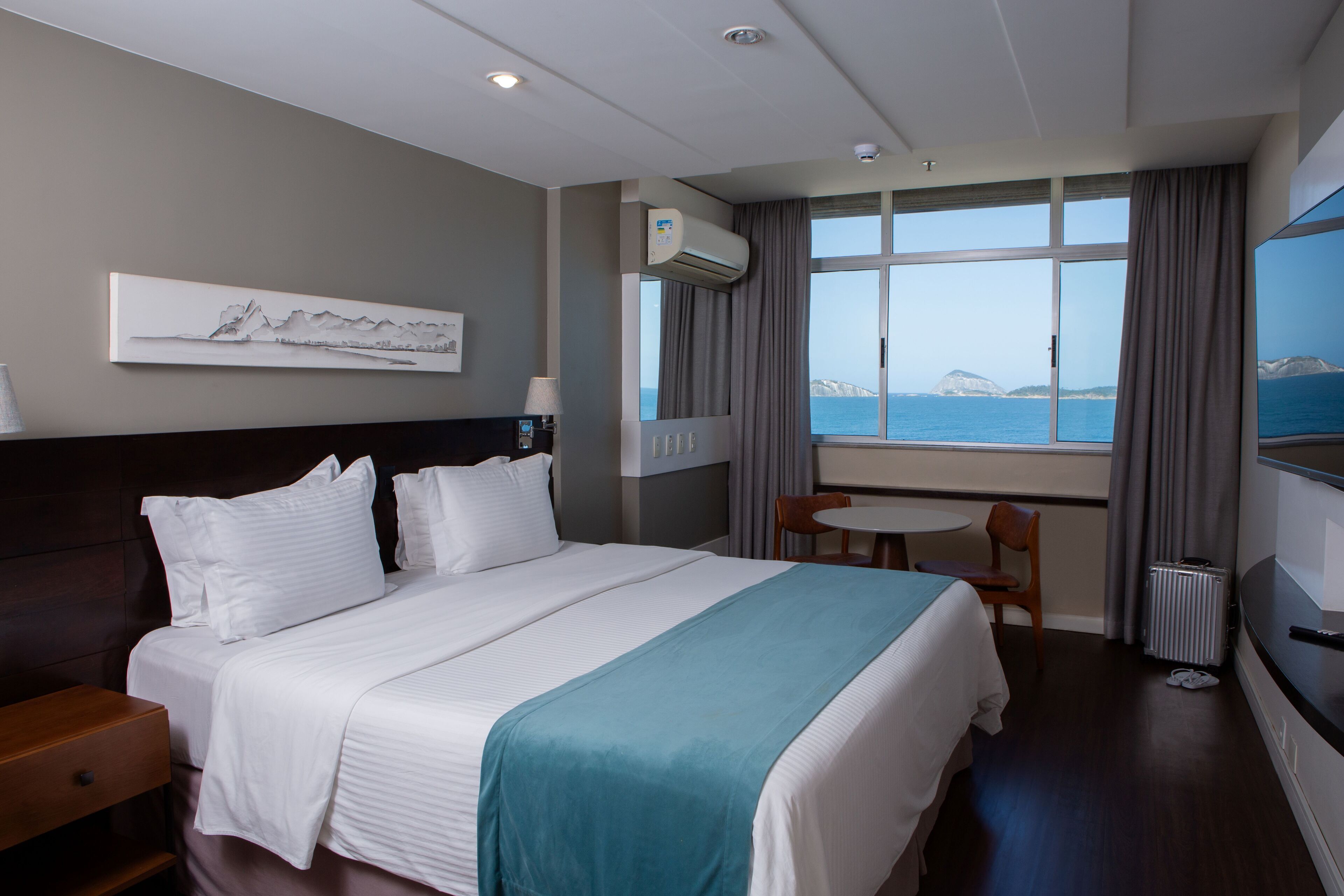 deluxe room, beach view | pillow-top beds, minibar, in-room safe, individually decorated