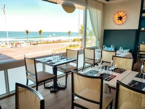 Breakfast, lunch, dinner served; beach views