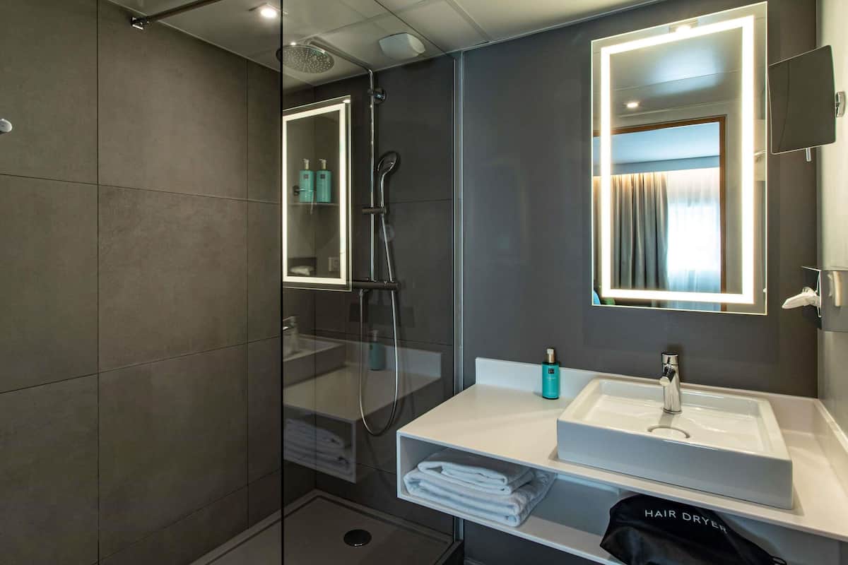 Premium bedding, memory-foam beds, in-room safe, blackout curtains
