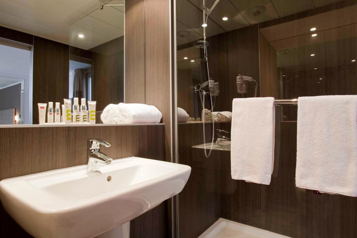shower, eco-friendly toiletries, hair dryer, towels