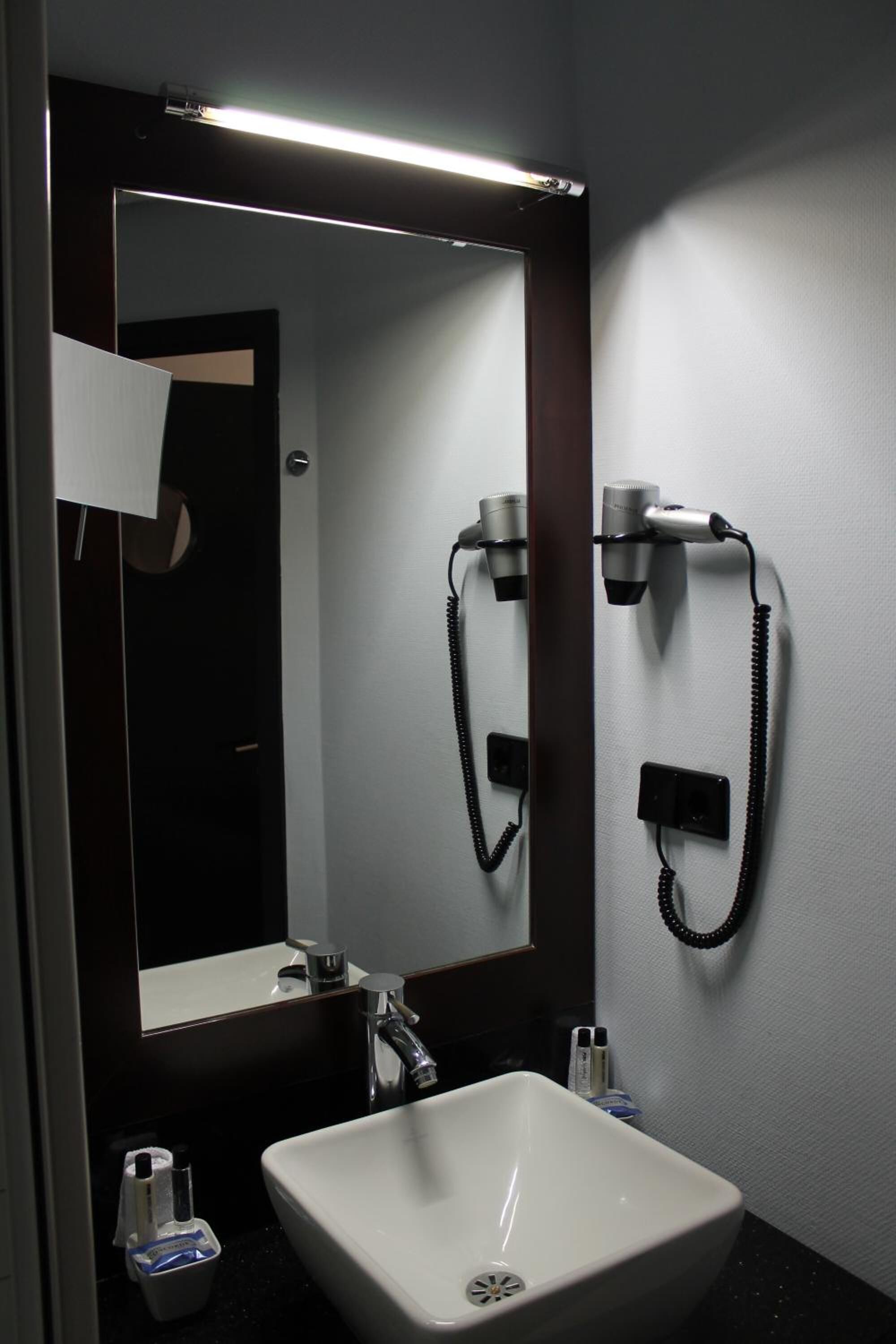 shower, designer toiletries, hair dryer, slippers