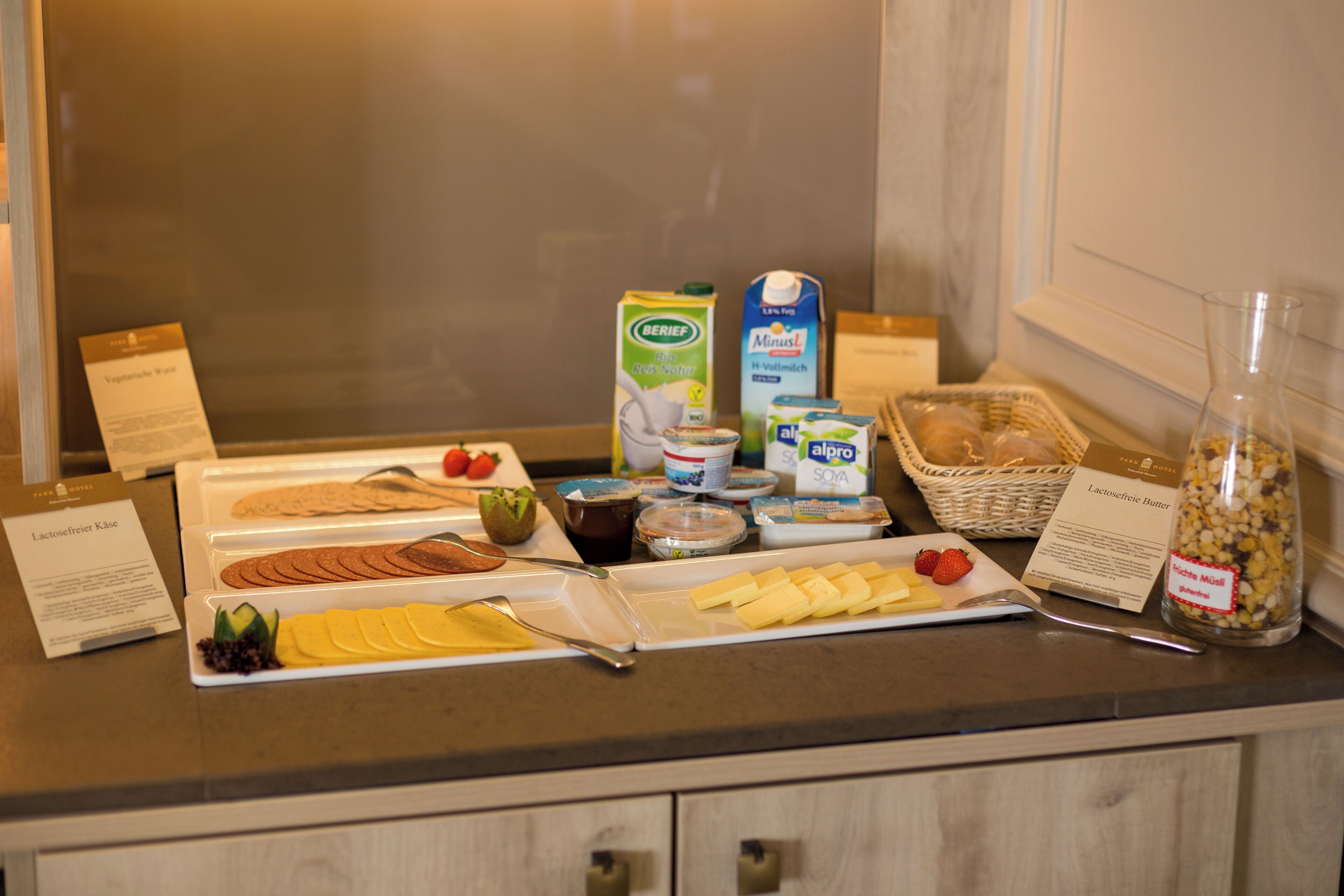 A breakfast buffet with various food items and dairy products.