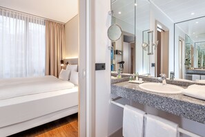 Eco-friendly toiletries, hair dryer, towels, toilet paper
