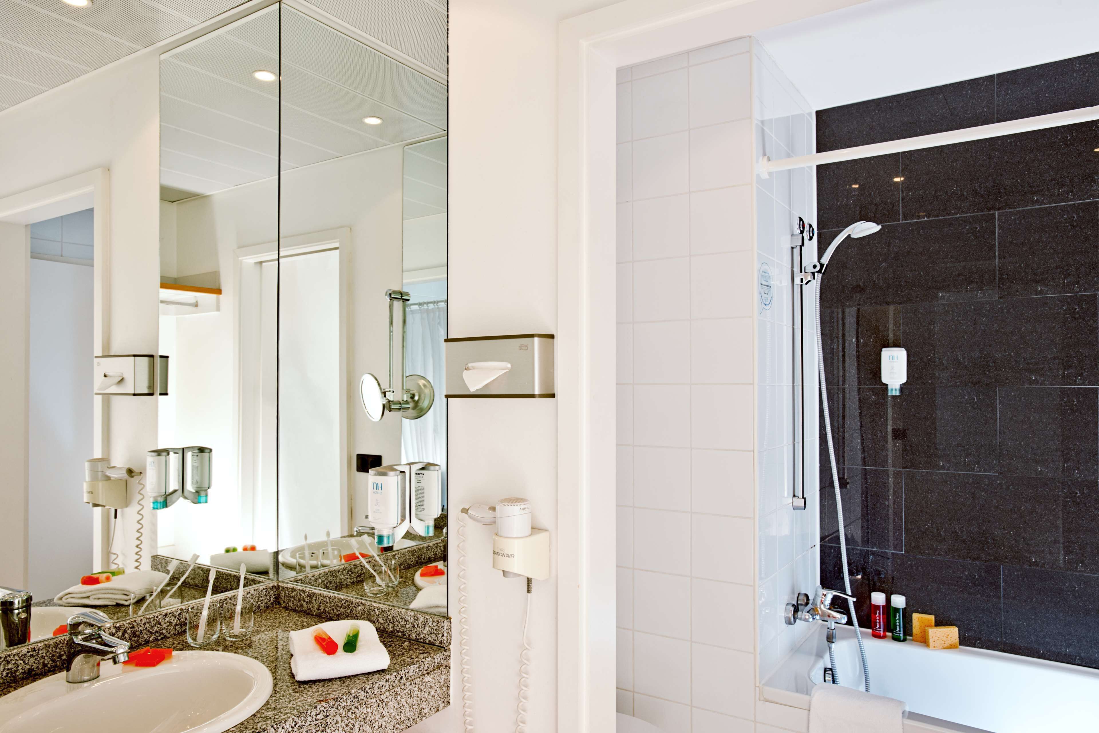 eco-friendly toiletries, hair dryer, towels, toilet paper