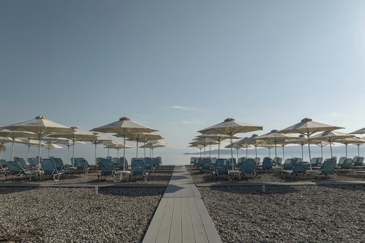 sun-loungers, beach umbrellas, beach towels