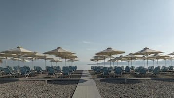 Sun loungers, beach umbrellas, beach towels