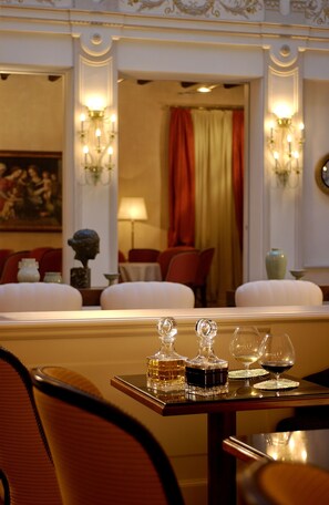 Enjoy a formal dining experience in this elegantly appointed room with a beautifully set table and comfortable seating.