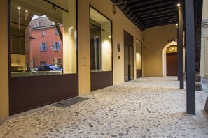 Leading to a space, this corridor offers a glimpse into the building's modern design.