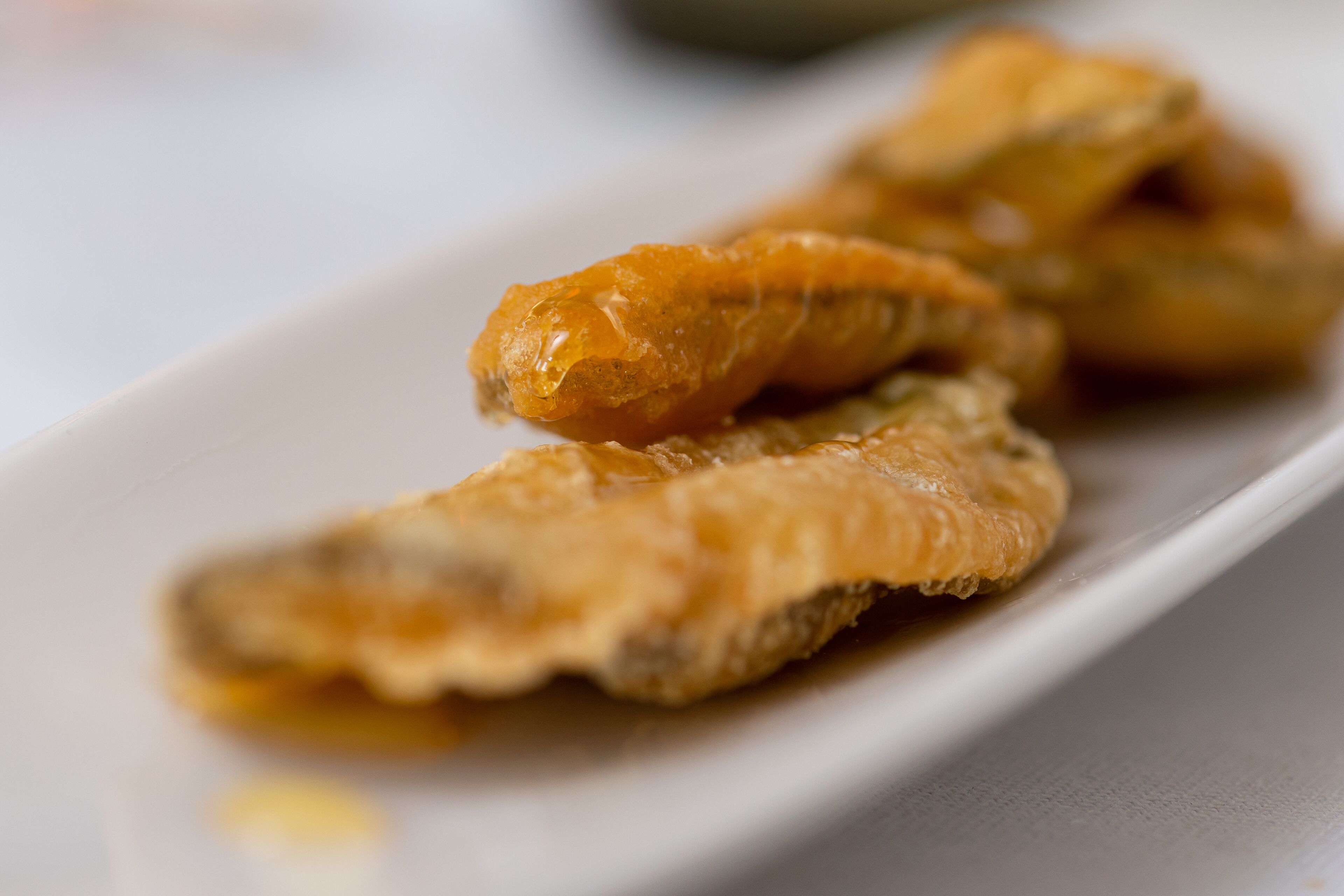 A plate with fried fish.