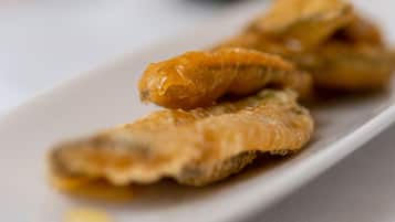 A plate with fried fish.