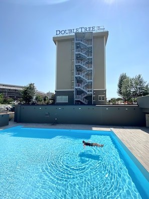 Seasonal outdoor pool, pool umbrellas, pool loungers