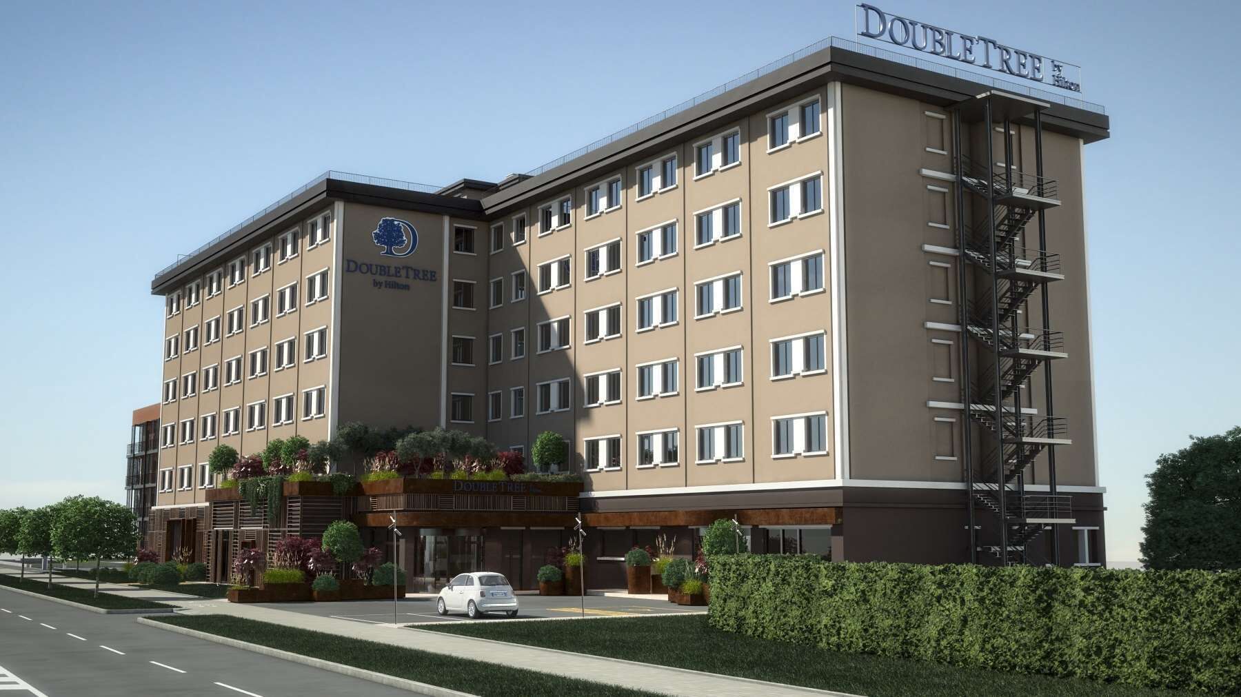 A modern hotel building with a sign reading "DOUBLETREE by Hilton".