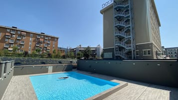 Seasonal outdoor pool, pool umbrellas, pool loungers