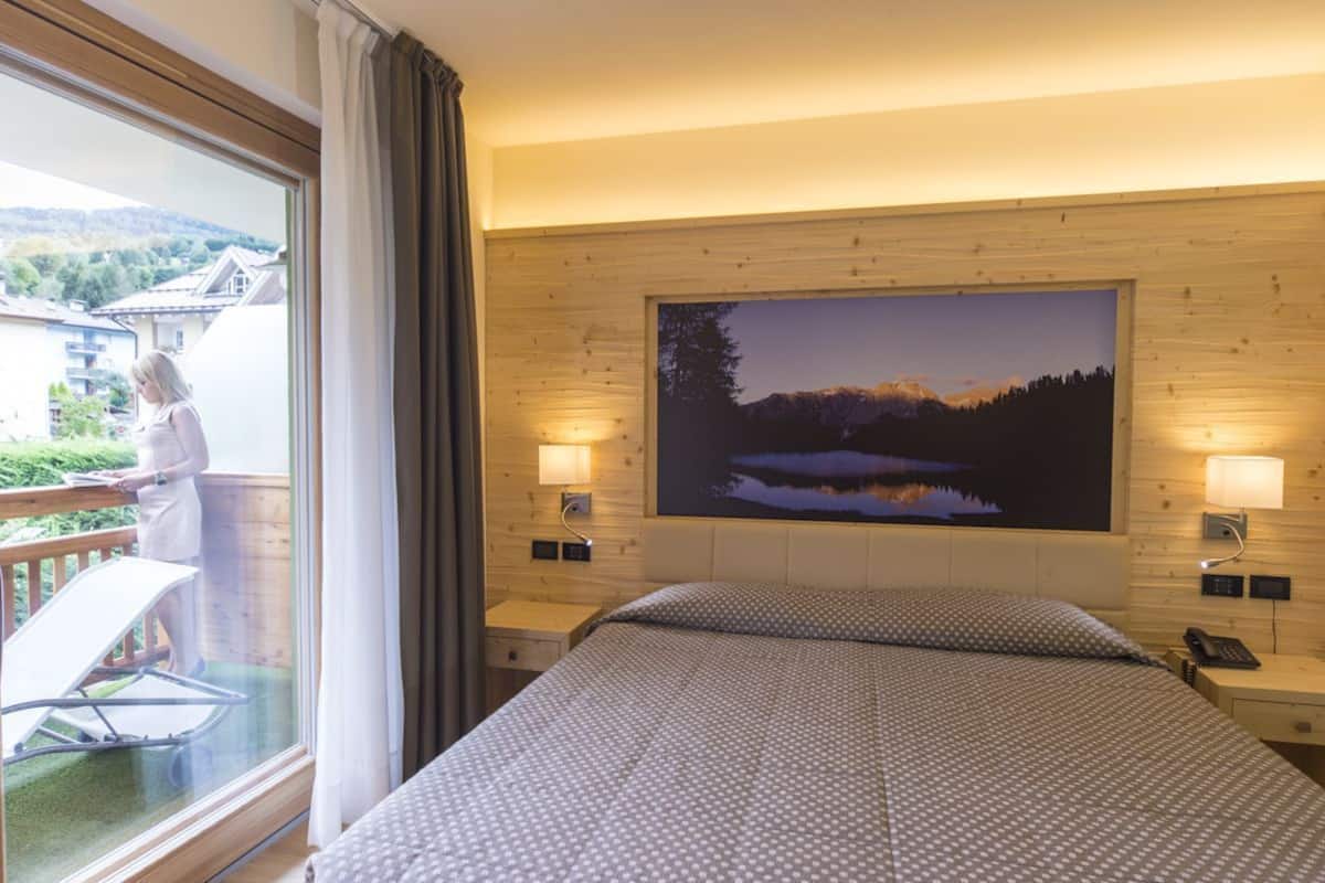 junior quadruple room | 1 bedroom, down duvets, minibar, in-room safe