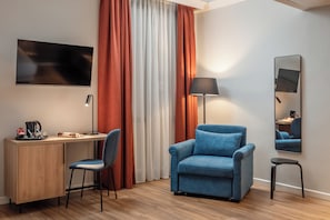 Family Room | Minibar, desk, blackout drapes, iron/ironing board