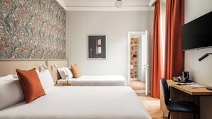 A hotel room with two beds, a desk, a chair, a TV, and a bathroom visible through an open door. - BYPILLOW Goldoni (Florence)