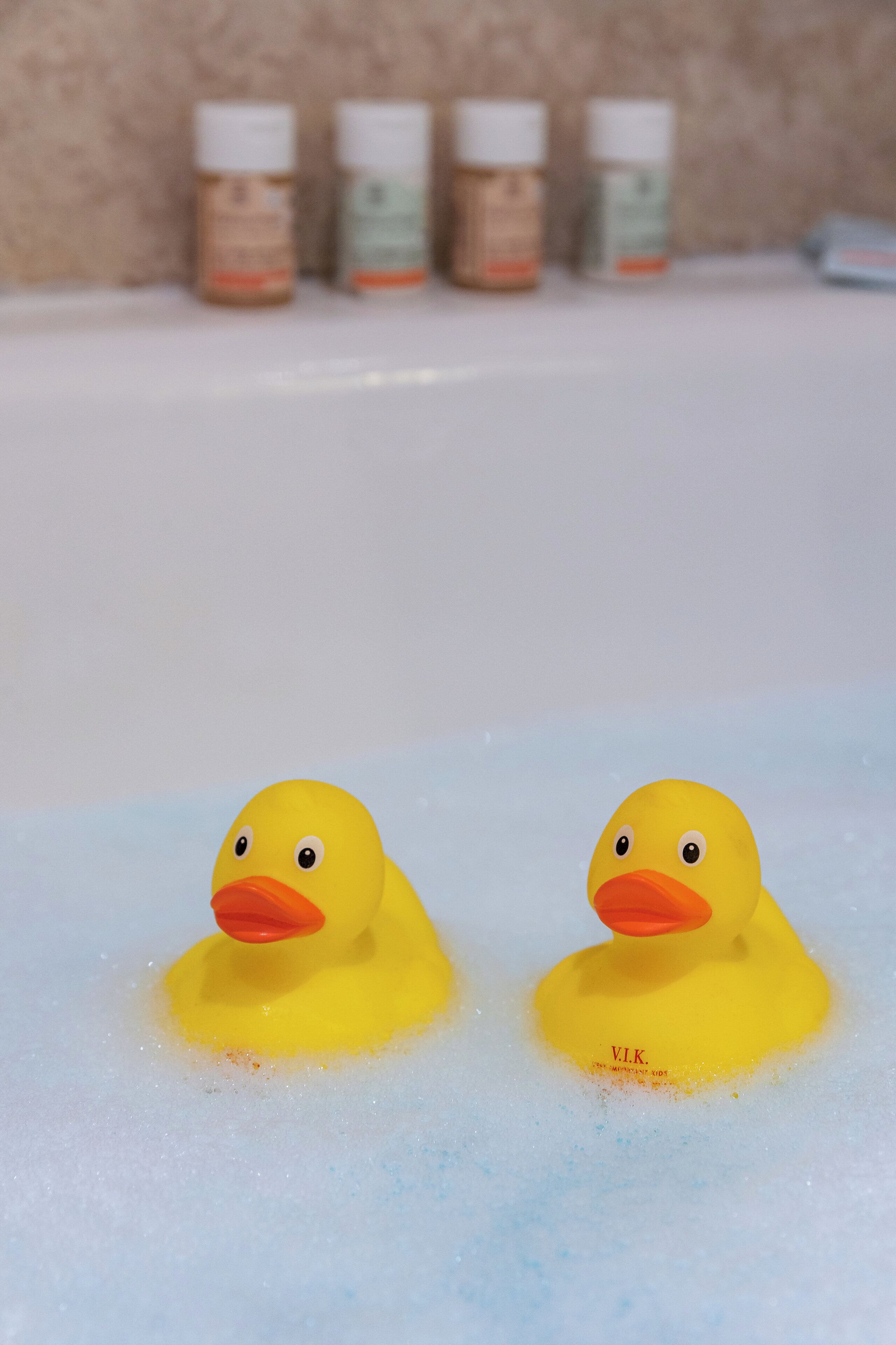 family room | bathroom | combined shower/bathtub, designer toiletries, hair dryer, slippers