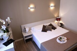 Donzen dekbedden, een minibar, een kluis op de kamer, een bureau