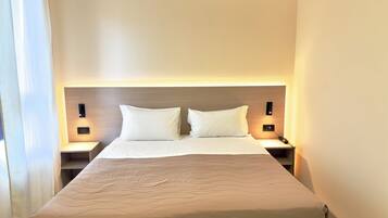 Premium bedding, down comforters, in-room safe, desk