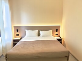 Premium bedding, down comforters, in-room safe, desk