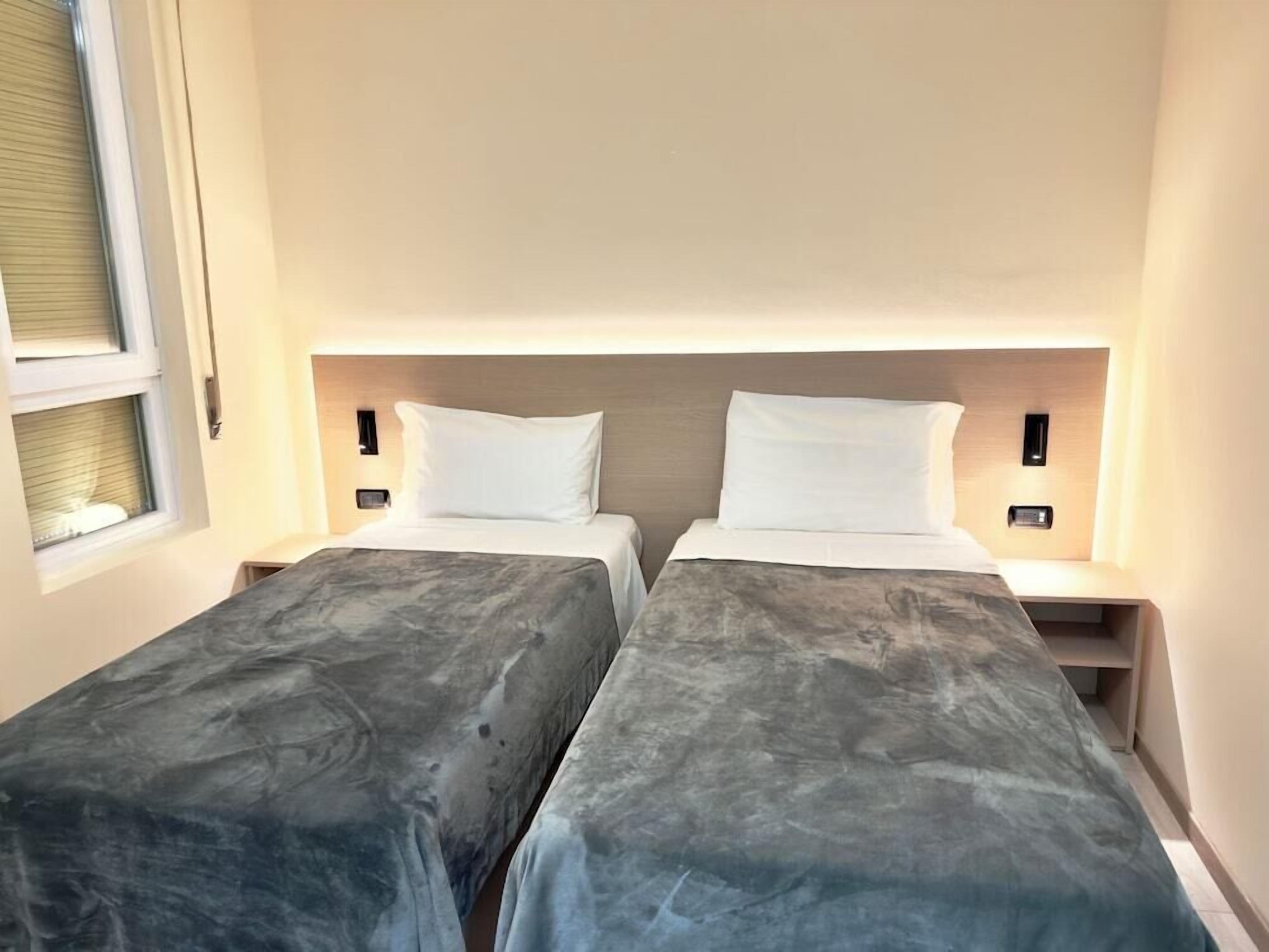 Premium bedding, down duvets, in-room safe, desk