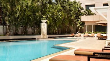 Outdoor pool, open 6 AM to 8 PM, pool umbrellas, pool loungers