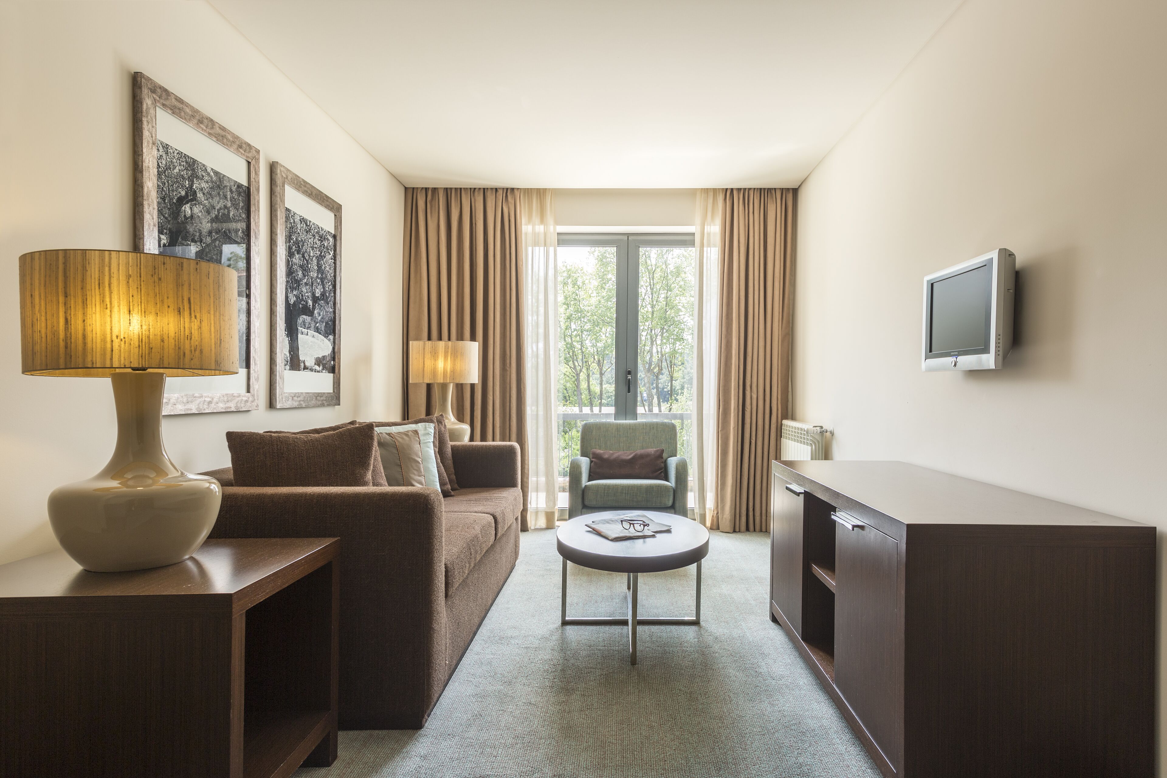 family room | 1 bedroom, minibar, in-room safe, desk