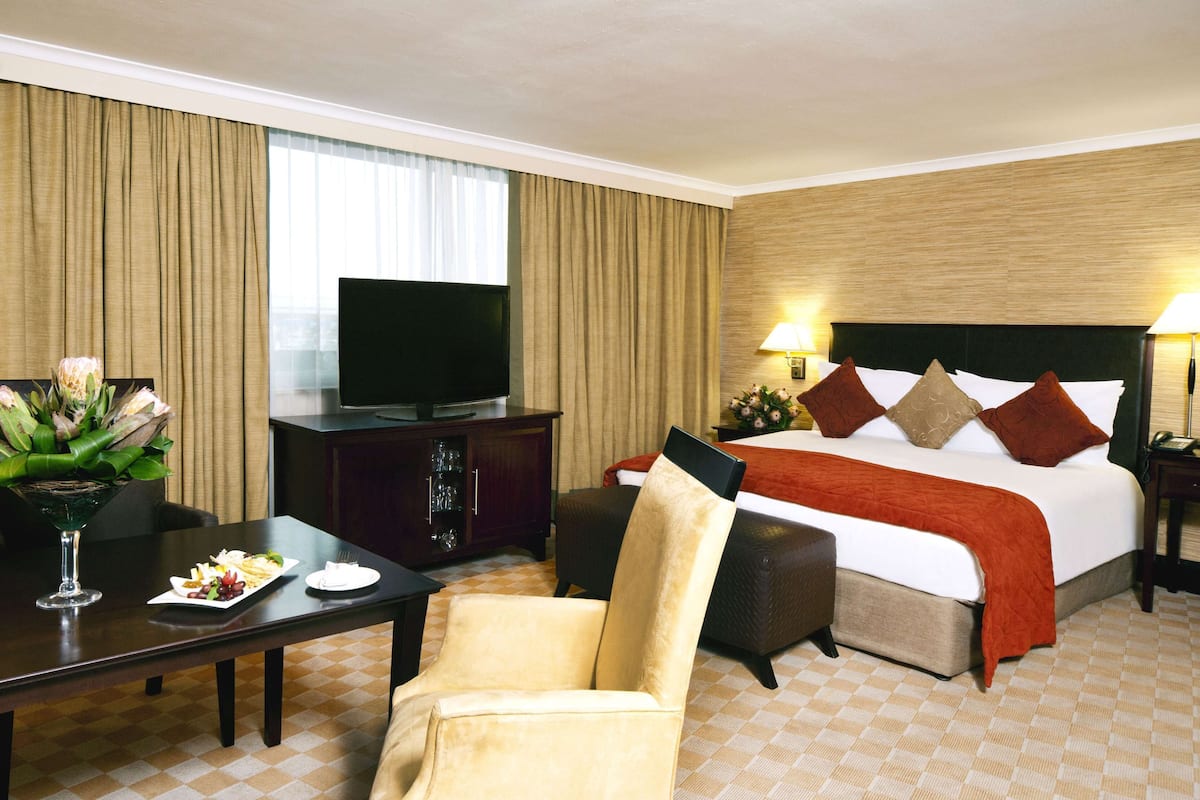executive room | in-room safe, desk, laptop workspace, blackout curtains