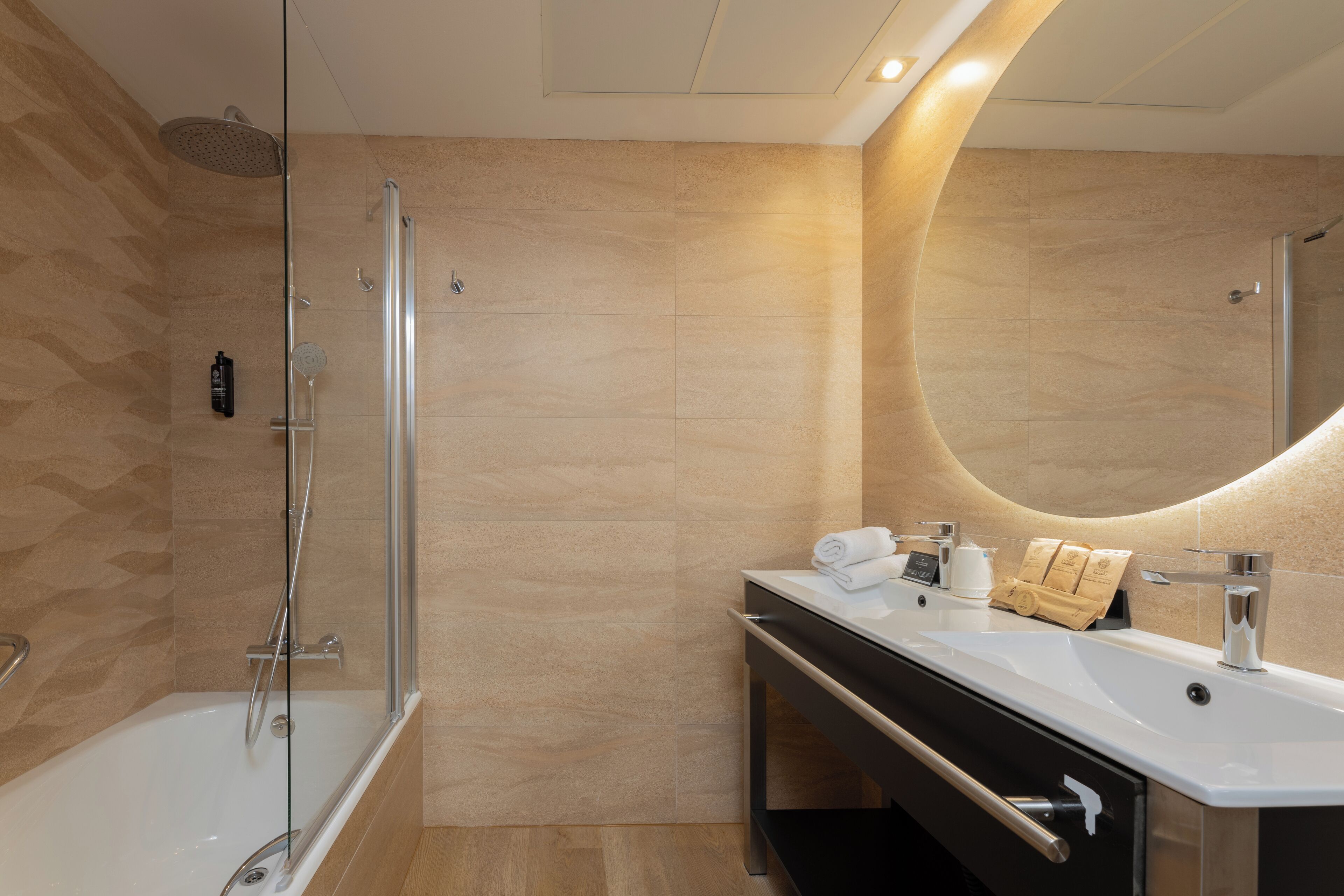 quadruple room | bathroom | rainfall showerhead, eco-friendly toiletries, hair dryer, towels