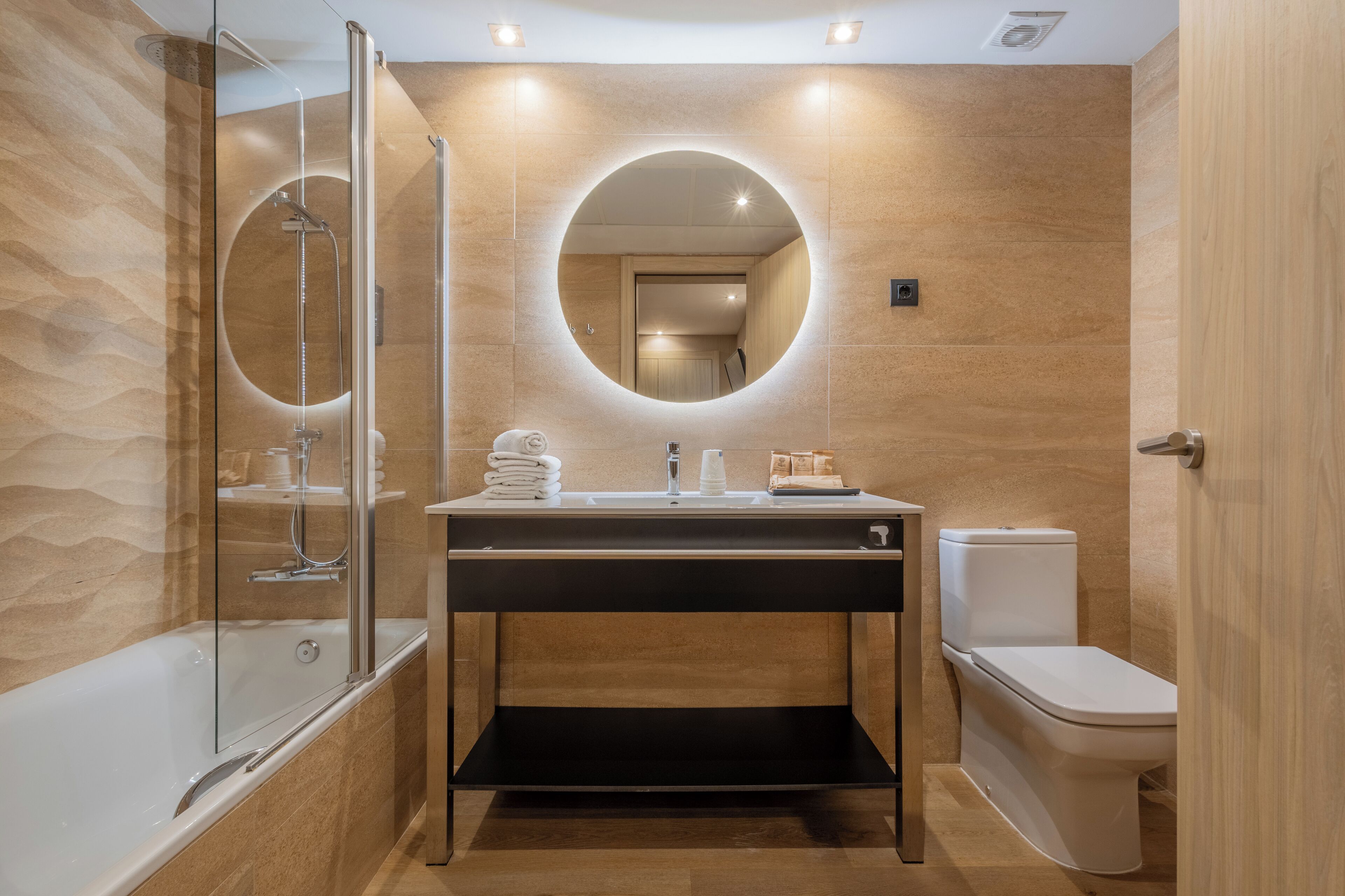 quadruple room | bathroom | rainfall showerhead, eco-friendly toiletries, hair dryer, towels