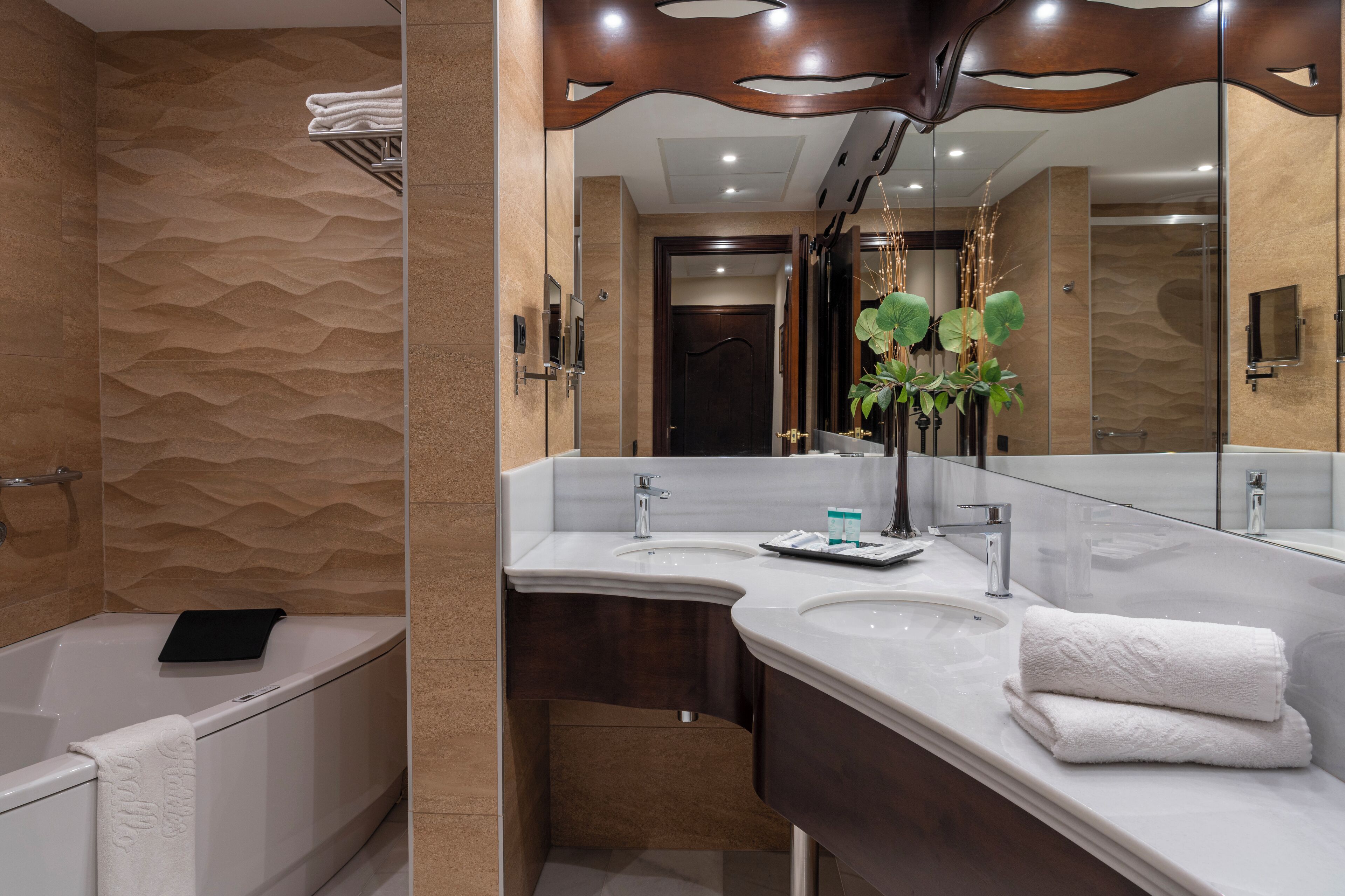 rainfall showerhead, eco-friendly toiletries, hair dryer, towels