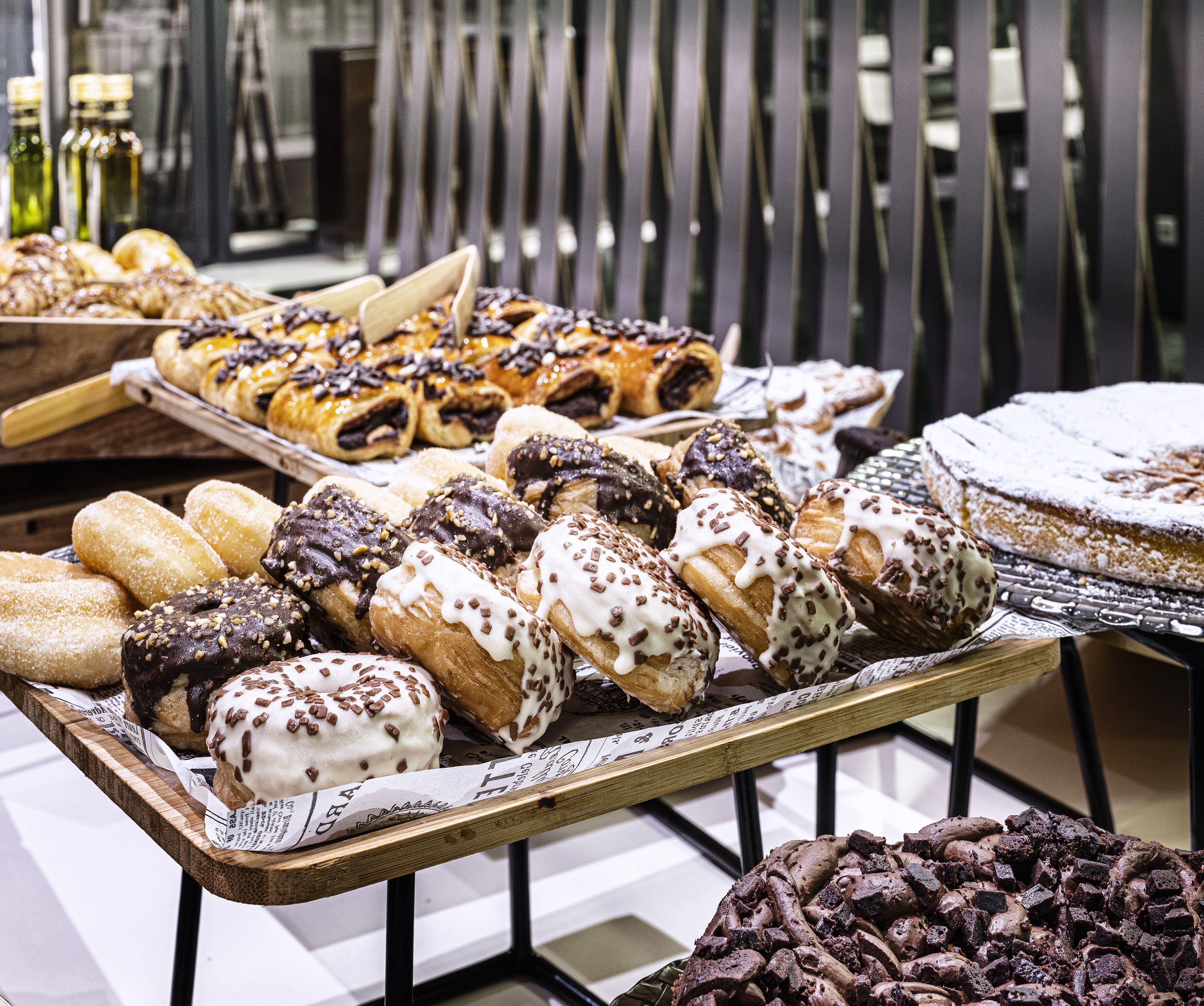 A variety of pastries displayed on trays.