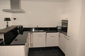 Condo, 1 Bedroom (additial CHF 80,00 cleaning fee) | Private kitchen | Coffee/tea maker
