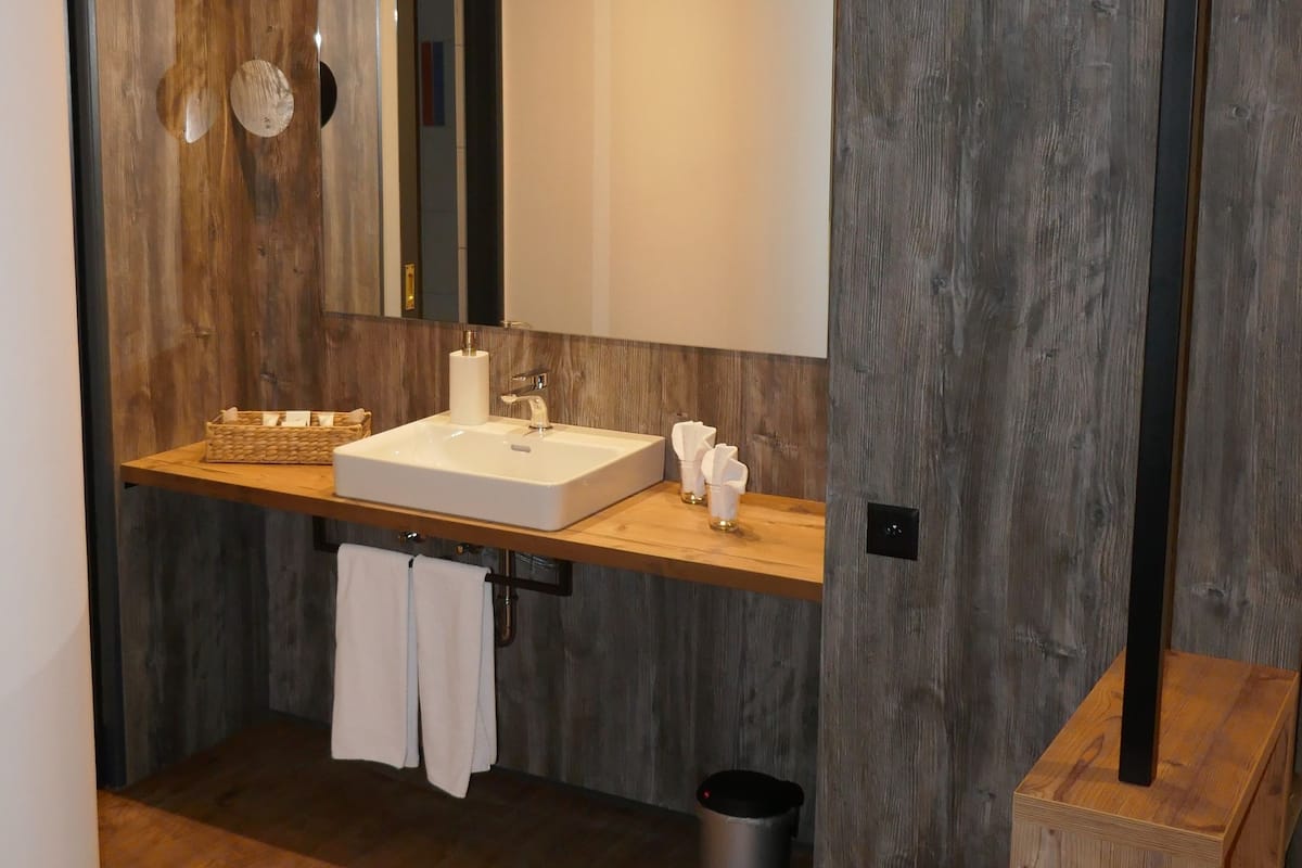 rainfall showerhead, hair dryer, bathrobes, slippers