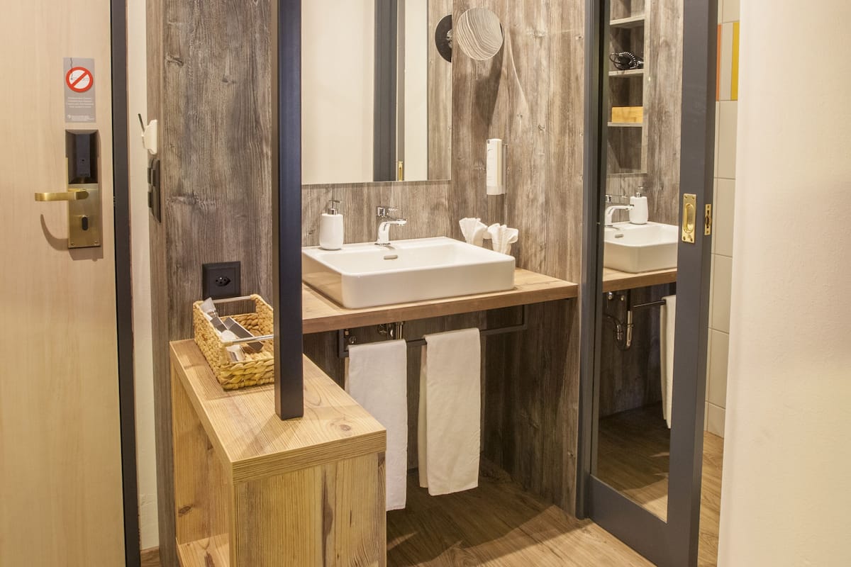 rainfall showerhead, hair dryer, bathrobes, slippers